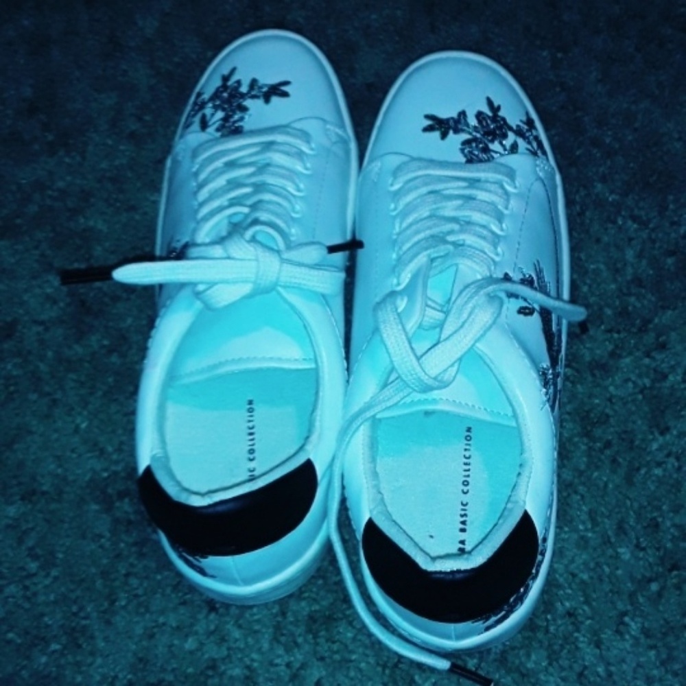 White shoes with floral designs.